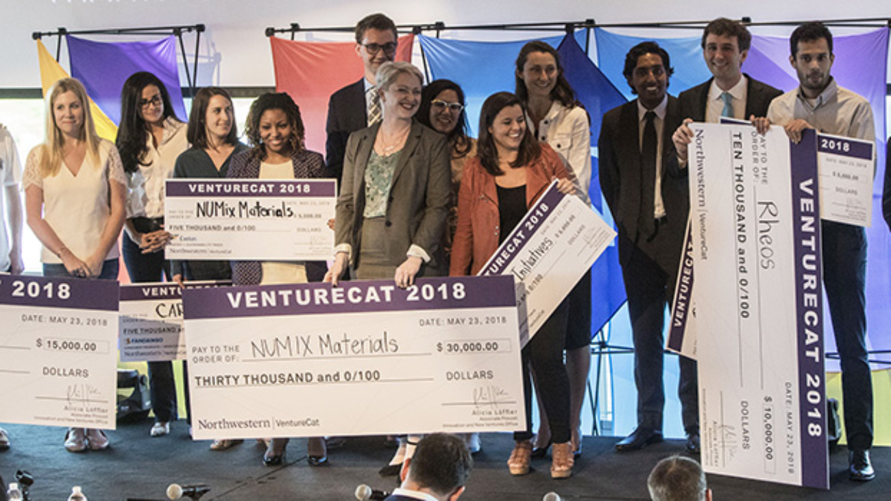Panoramic photograph of winning teams at VentureCat 2018.